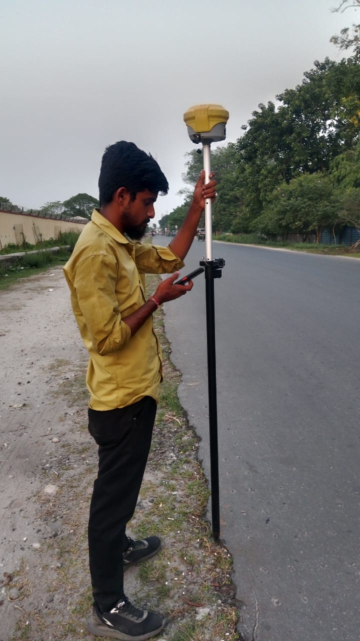 Surveyor taking measurements