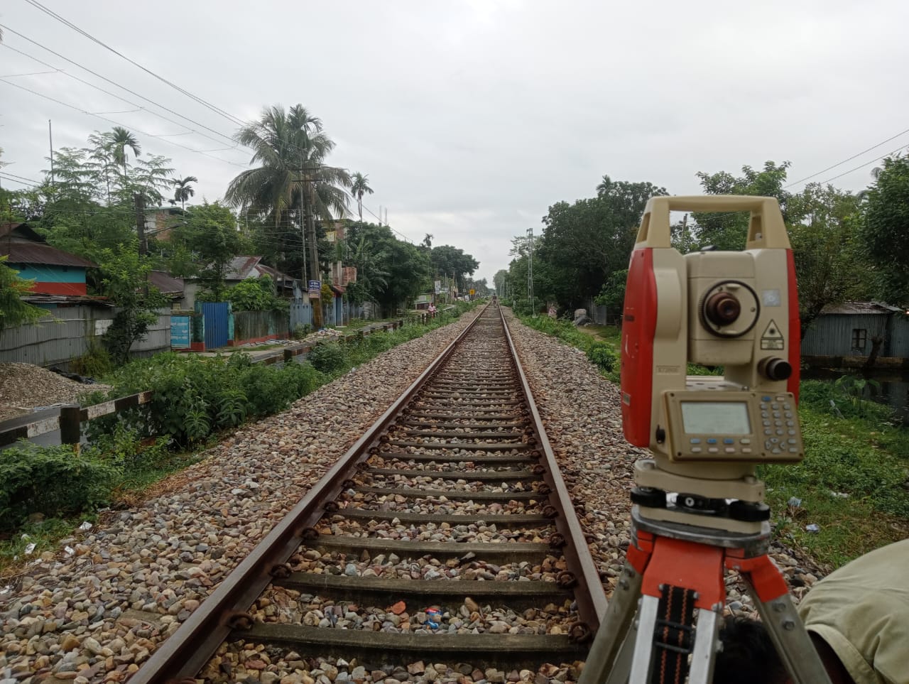 Surveyor working on a field